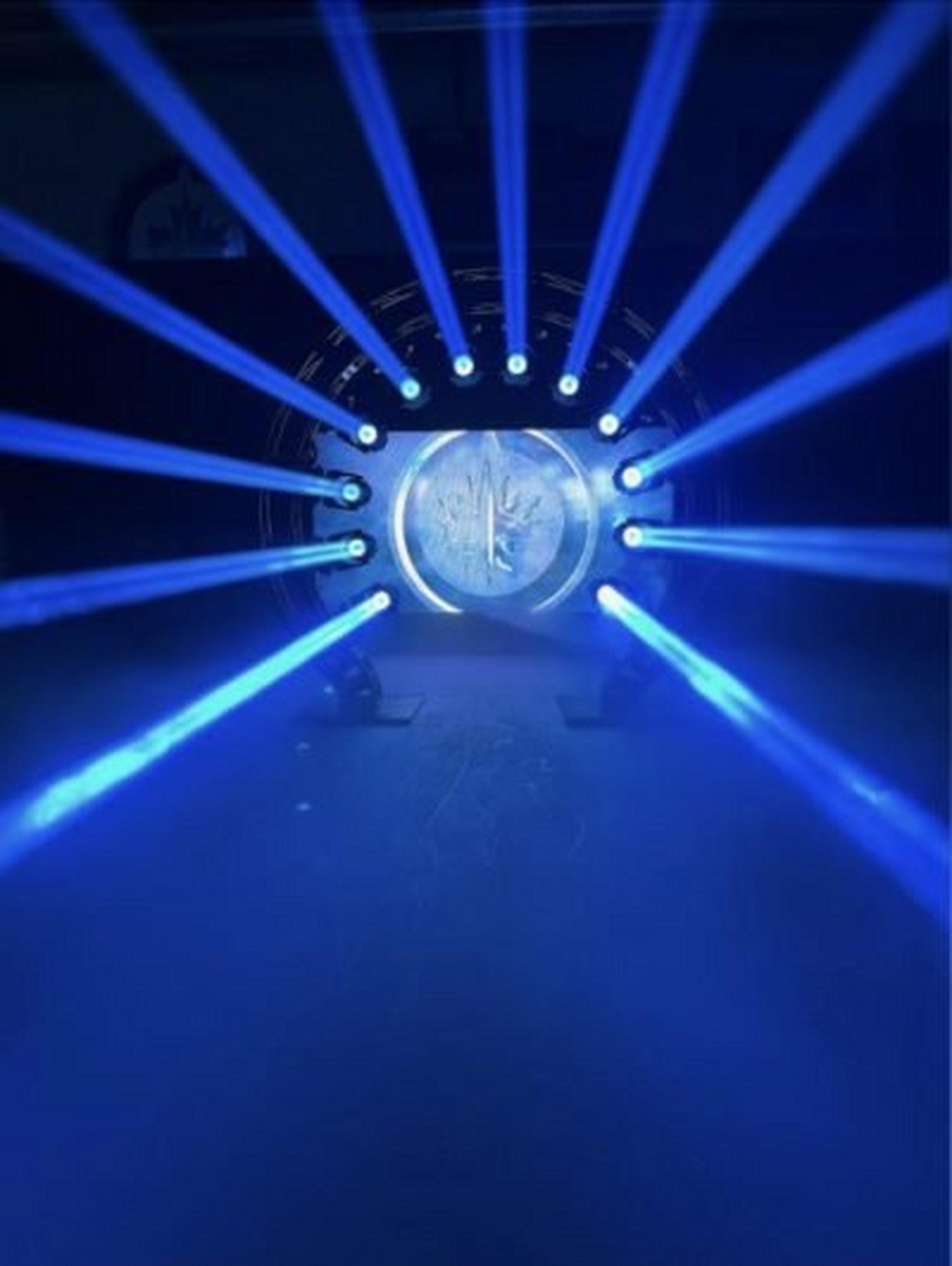 a blue light is shining on a blue background